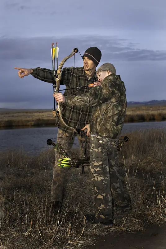 Boy Learning To Shoot a Compound Bow