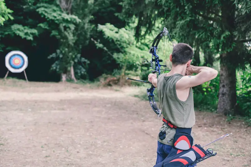 Boy Shooting Compound Bow