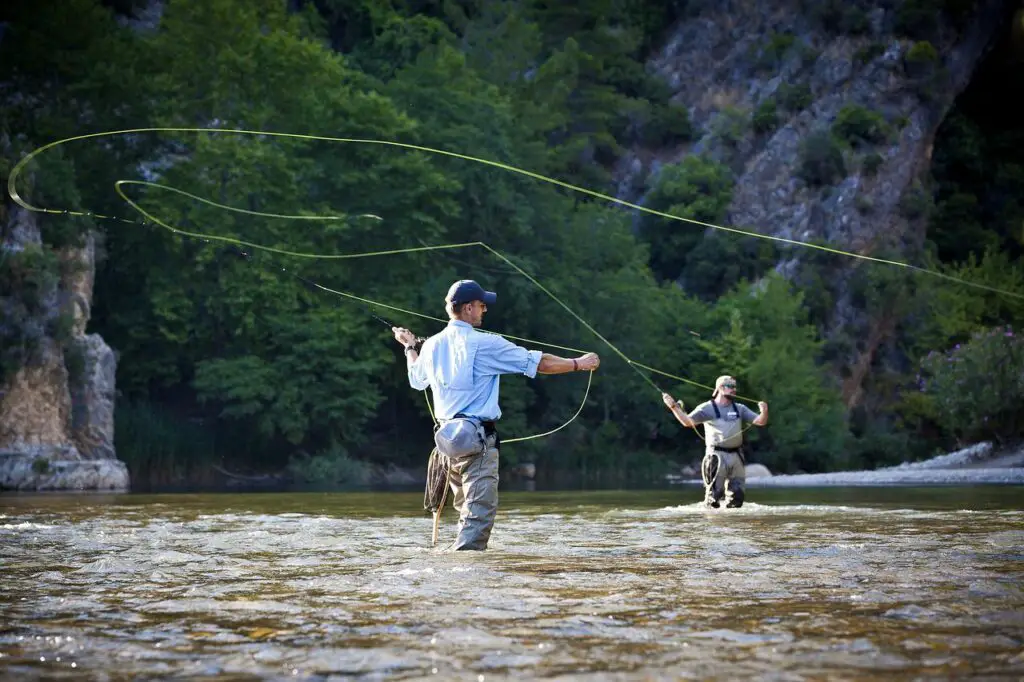 Two men using fly fishing rods