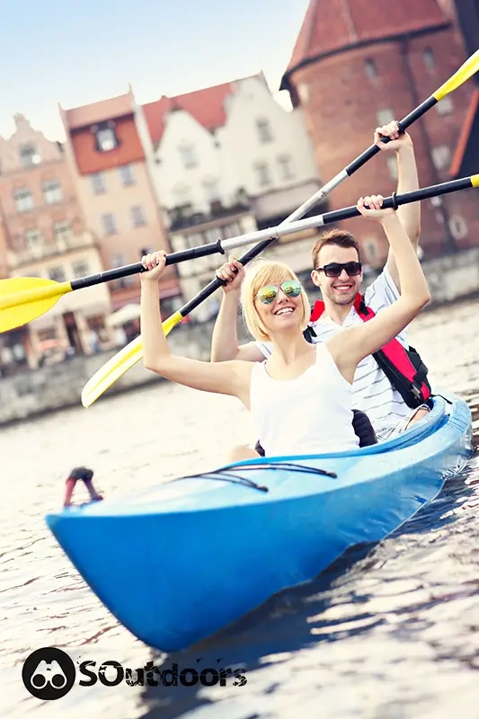 A picture of a young couple in a canoe sight seeing in Poland