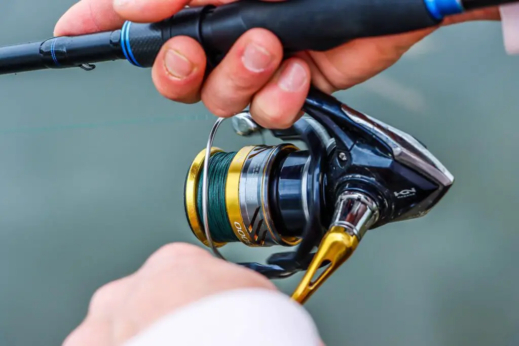 Steal fishing rod with a gold plated spinning reel