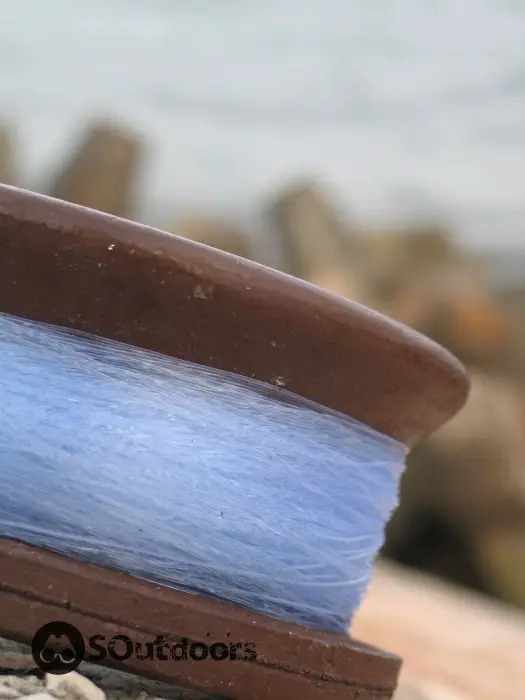 Monofilament line attached to a wooden reel