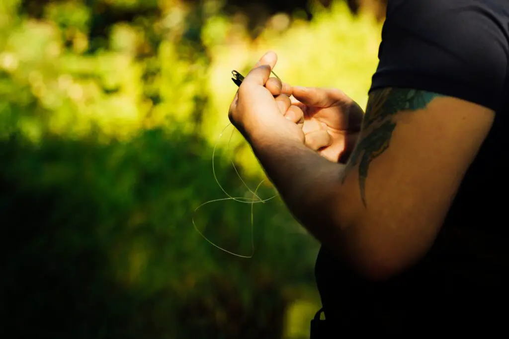 A man carefully selects a fishing line