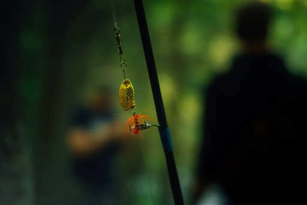 A focused photo of a fishing rod with a lure