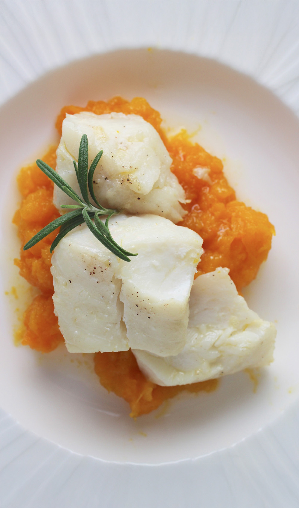 6-Olive Oil Poached Cod with Rosemary, Garlic & Lemon-poached-cod-in-plate Olive Oil Poached Cod with Rosemary, Garlic & Lemon